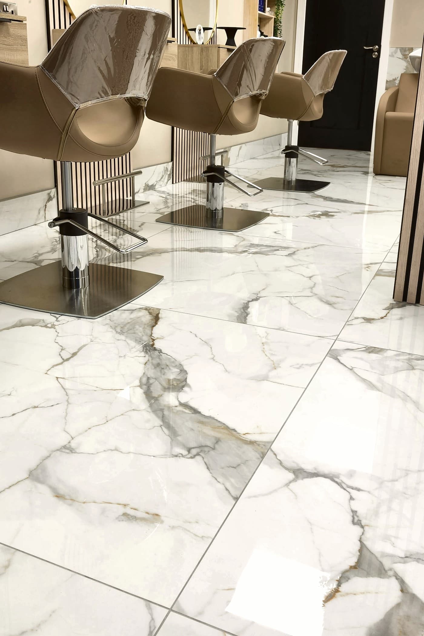 Polished white marble floor tiles with grey veining